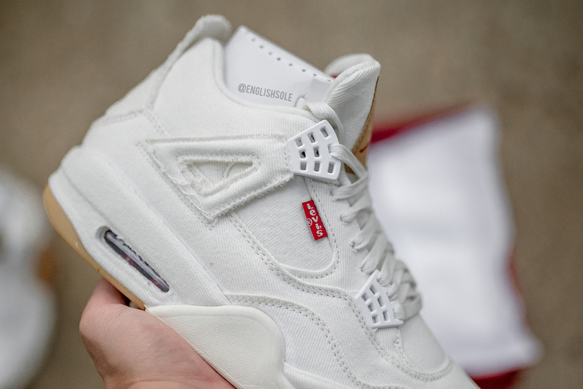 White-Denim-Levis-Air-Jordan-4-In-Hand.jpg