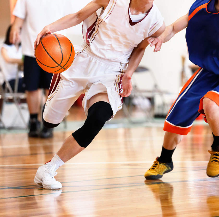 High-school-student-dribbling-past-a-defender.jpg